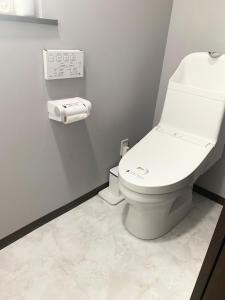 a bathroom with a white toilet in a room at Svalbard Residence - Vacation STAY 18446 in Minamifurano