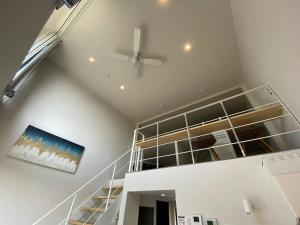 a white staircase in a house with a ceiling at THE LAND HOTEL - Vacation STAY 16173v in Arao +1 photo
