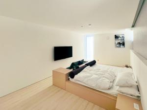 Ένα ή περισσότερα κρεβάτια σε δωμάτιο στο CORAL RESORT VILLA atsuhama - Vacation STAY 21288v