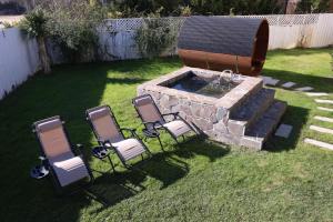 a group of chairs and a fountain in a yard at Cardiff-Kujukuri- - Vacation STAY 35134v in Kujukuri