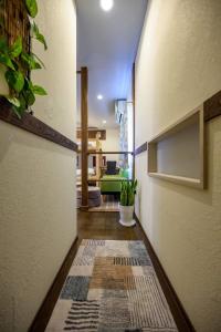a hallway with a rug on the floor at Hyuga Surf Camp 212 - Vacation STAY 35446v in Hyuga