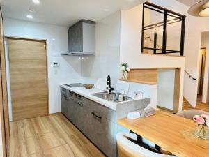 a kitchen with a sink and a counter at Hikarinoyado Yamate - Vacation STAY 18639 in Sasebo +38 photos