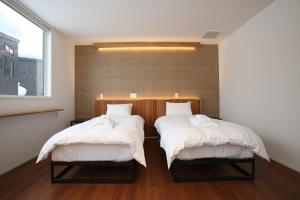 Postel nebo postele na pokoji v ubytování Alpine Tenshi Villas - Vacation STAY 61146v