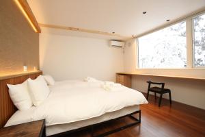 Postel nebo postele na pokoji v ubytování Alpine Tenshi Villas - Vacation STAY 60200v