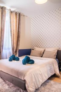 Ένα ή περισσότερα κρεβάτια σε δωμάτιο στο Appartement entier cosy