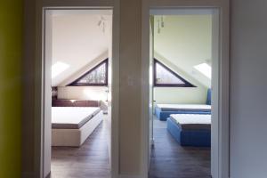 Posteľ alebo postele v izbe v ubytovaní Apartamenty Tatrzańskie Turnie Krupówki