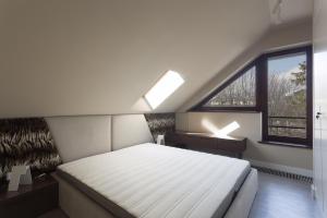 Posteľ alebo postele v izbe v ubytovaní Apartamenty Tatrzańskie Turnie Krupówki