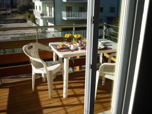 A balcony or terrace at Residence Rivachiara (check-in at Hotel Riviera in Viale Rovereto, 95)