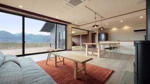 a living room with a couch and a table at Retreat to the beautiful Nanatsumori - Vacation STAY 60312v in Taiwa