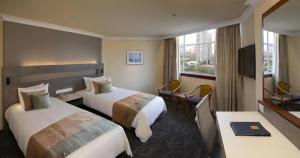 Postel nebo postele na pokoji v ubytování Hotel Miramar Singapore + 92 fotografií