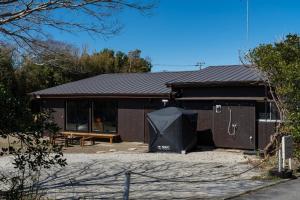 a brown building with a picnic table in front of it at Asahi - House - Vacation STAY 18691 in Asahi