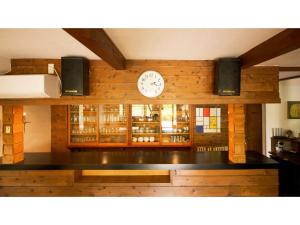 a counter with a clock on the wall of a store at Pension Jogasaki - Vacation STAY 62011v in Ito