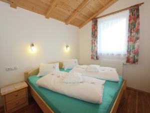 two beds in a room with a window at Apartment in Fügenberg near Ski Slopes in Fügenberg