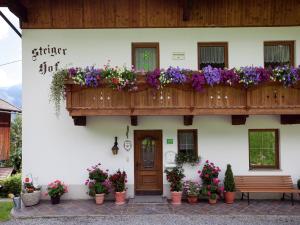 a building with a balcony filled with flowers at Apartment in Fügenberg near Ski Slopes in Fügenberg