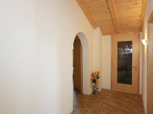 a hallway with a vase with flowers in it at Apartment in Fügenberg near Ski Slopes in Fügenberg