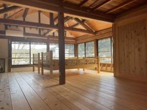 a large room with a table and some windows at NATURE HEALING KAMIYAMA - Vacation STAY 71981v in Yorii
