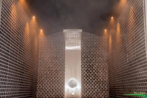 a shower in the middle of a building with lights at La Villetta Sul Mavone in Colledara