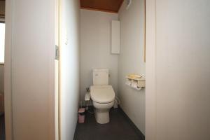 a bathroom with a toilet in a small room at Ryuyo Marine Park Auto Campsite - Vacation STAY 78095v in Kaketsuka