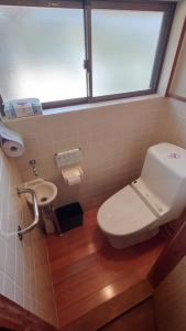 a bathroom with a toilet and a sink at Amakusa West Coast Takahama-ya - Vacation STAY 80953v in Amakusa