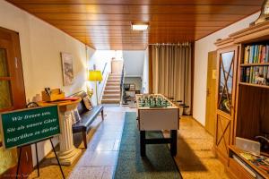 a living room with a chess table in a room at Ferienhaus Vier Jahreszeiten in Frauenwald