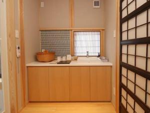 a small kitchen with a sink and a window at A-UN INN - Vacation STAY 84863v in Aizuwakamatsu +35 photos
