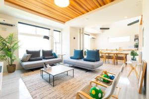 a living room with couches and a table at Bridge View Villa - Vacation STAY 80945v in Awaji