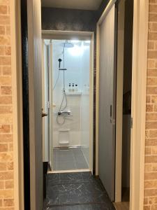 a bathroom with a shower with a glass door at VILLA PRECI - Vacation STAY 85974v in Teruma +18 photos