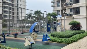 a playground in front of a building at Danga Bay Coastal Comfort 3BR 8Pax w 3Balcony by Our Stay in Johor Bahru