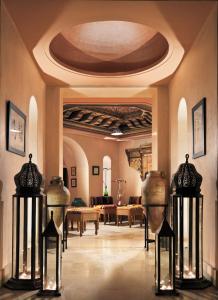 a lobby with vases on display in a building at Iberostar Selection Royal El Mansour in Mahdia