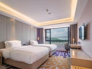 Postel nebo postele na pokoji v ubytování Lavande Hotels· Guiyang Huaxi Tongshijie + 212 fotografií