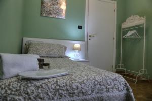Postel nebo postele na pokoji v ubytování La Casetta di Lina Rooms and Apartments