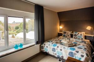 Postel nebo postele na pokoji v ubytování B&B 't Solveldje