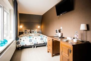 Postel nebo postele na pokoji v ubytování B&B 't Solveldje