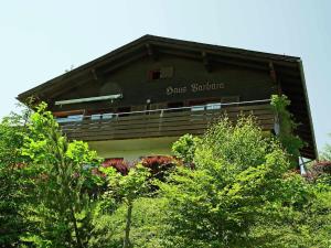 a building with a sign on the side of it at Chalet in Vorarlberg in Egg