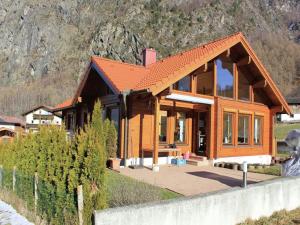 a small wooden house in front of a mountain at Chalet in Ötztal near Ötz-Hochötz Ski Resort in Umhausen +19 photos