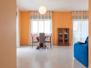 a dining room with a table and chairs at Etna & Sea View Apartment in Giarre