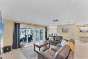 a living room with a couch and a table at GRH14784 - Charlotte County - 4 Bed 2 Baths House in Punta Gorda Isles
