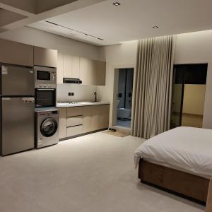 Η κουζίνα ή μικρή κουζίνα στο نزل لينزا هاوس linza suites