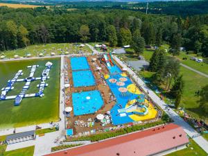 an aerial view of a water park with several pools at Domki Polanica in Polanica-Zdrój