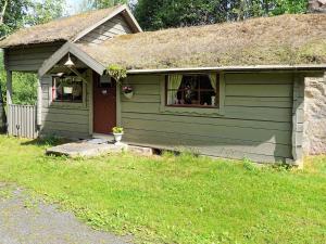 a small green house with a grass roof at 5 person holiday home in Tingsryd in Tingsryd