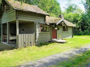 a small green house with a grass roof at 5 person holiday home in Tingsryd in Tingsryd
