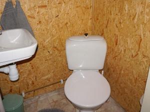a bathroom with a white toilet and a sink at 5 person holiday home in Tingsryd in Tingsryd +24 photos