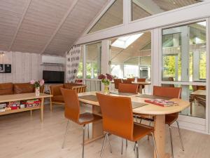 a dining room with a table and chairs at 4 star holiday home in Hovborg in Hovborg