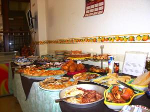 a buffet with many different types of food on a table at Locanda Degli Agrumi in Conca dei Marini