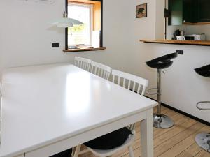 a kitchen with a white counter top in a room at 6 person holiday home in Hadsund in Hadsund +25 photos