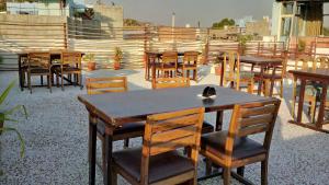 a group of tables and chairs on a patio at Namaste Caffe-for heritage stay in Jodhpur