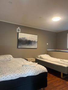 Ένα ή περισσότερα κρεβάτια σε δωμάτιο στο Tromsø City Apartment