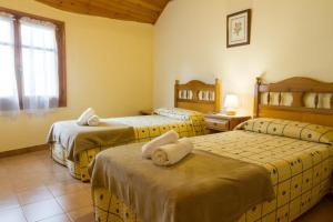 Posteľ alebo postele v izbe v ubytovaní Hostal Aiguamog