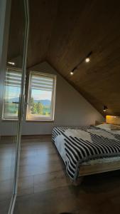 a bedroom with a bed and a window at Вирій in Slavske