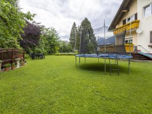 a trampoline in the yard of a house at Apartment in Tröpolach near Nassfeld in Tröpolach